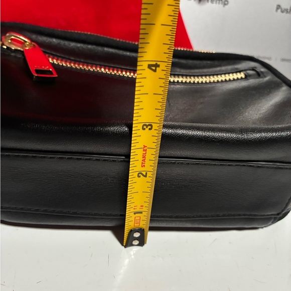 Tumi crossbody bag.
Length is 8.5 inches 
Height is 5.5 inches - Picture 15 of 15